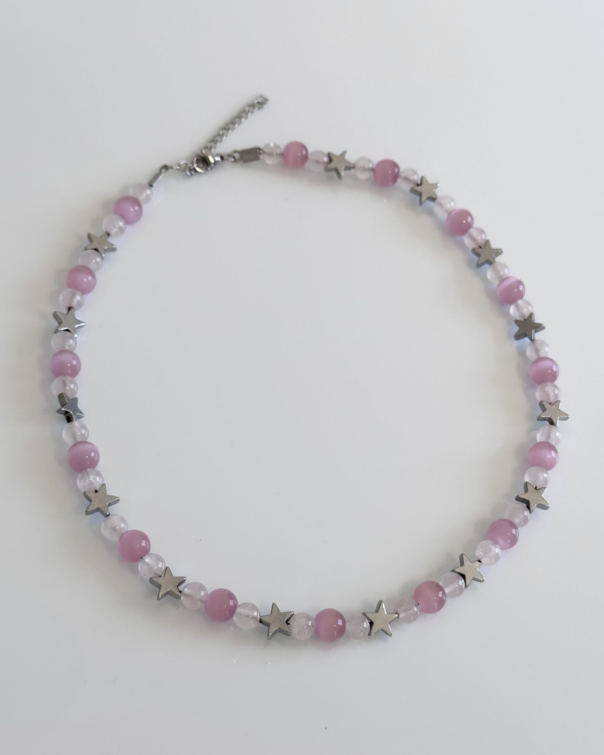 Rose quartz beaded necklace with silver hematite stars and adjustable stainless steel closure, handmade by NIICA in Lisbon
